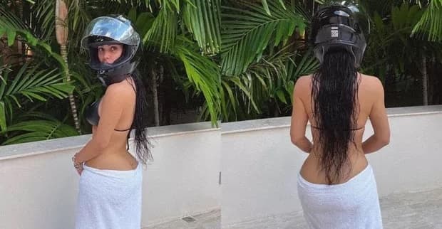 Kim Kardashian brinca ao posar de toalha e capacete: "Sempre pronta"